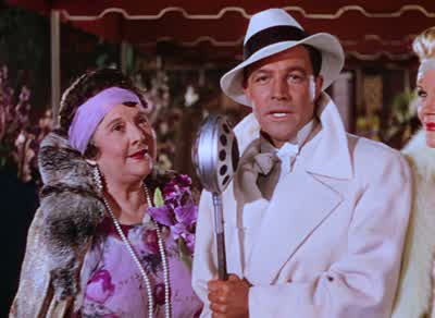 They sent me to the finest schools including dancing schoolThat's where I first met cosmoAnd with him I used to perform for mum and dad's society friends - Singin' in the Rain