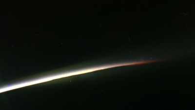 They swirled around his capsule
like tiny weightless diamonds, - The Real Right Stuff