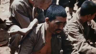 They too are exhausted,
but unwilling to quit. - The Pacific War in Color