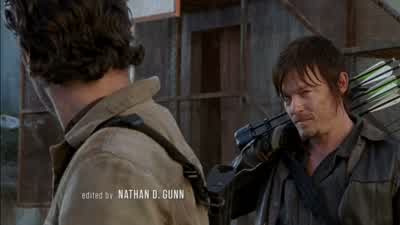 They try to drive up to the gate again, maybe some blown tires will stop them. - The Walking Dead