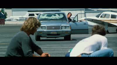 I'm not armedBut you're not alone Good guessThere's a gun on you right nowWhere's RoachHe's around somewhereSo listen Johnny we are in kind of a hurryWhat do you needYou gotta tell me where she isOh and let my policy expire Good ideaLook Bodhi man people - Point Break
