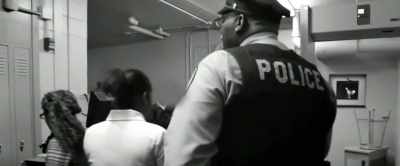 They're faced by security guards - Uncle Tom