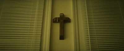 This crucifix only hung on
the wall with a single nail. - The Unbinding