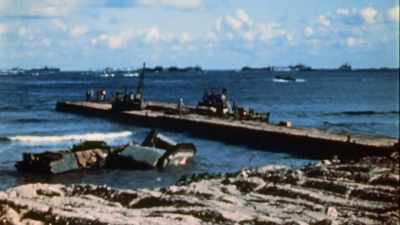 THIS IS A PONTOON CAUSEWAY,
A TEMPORARY FLOATING PIER. - The Pacific War in Color