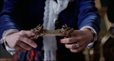 This magnificent pieceis encrusted with rubies and 15 emerald chipsIt was donated by morticia and Gomez AddamsRemember this year over half our proceedswill benefit the elderly and the mentally disabledI'll open the bidding at 5 000Five not good enough20 - The Addams Family