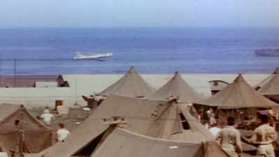 This one is so crippled it
can't even make the runway. - The Pacific War in Color