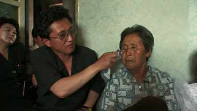 This party official is crying.
Even this government minder. - Inside North Korea: Then and Now with Lisa Ling