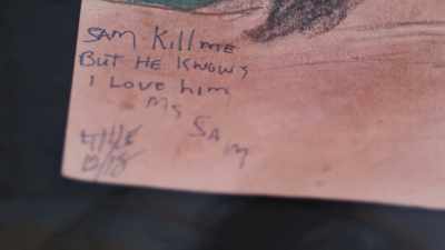 This reads, "Sam kill me
but he knows I love him. - Confronting a Serial Killer