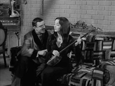 - Tish, our song.
- Hits you right here. - The Addams Family