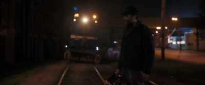 Tram stop running in
the night. Construction. - The Good Neighbor