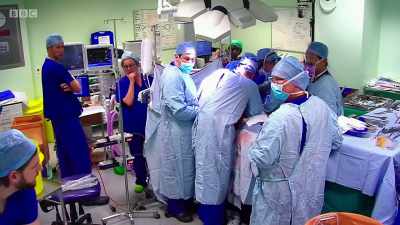 Trolley for her?
Trolley behind, please. - Surgeons: At the Edge of Life
