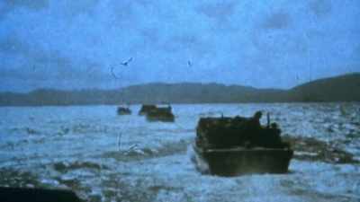 TROOP TRACTORS HAVE TO COME IN
ALMOST SINGLE FILE. - The Pacific War in Color