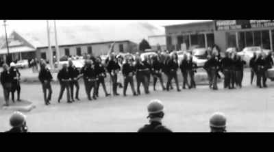 Troopers here,
advance toward the group. - All In: The Fight for Democracy