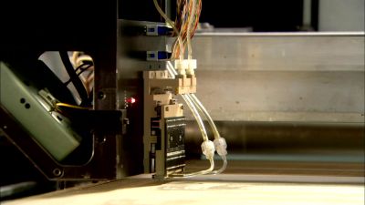 TUBES CARRY A BINDING SUBSTANCE
TO THE MACHINE'S PRINTHEAD. - How It's Made