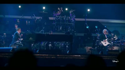 ♪ Turning back, she just laughs ♪ - Elton John Live: Farewell from Dodger Stadium