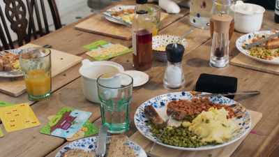 TV on, meals at the dining
table half eaten, - Beyond Paradise