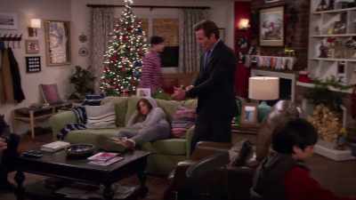 [TV playing indistinctly] - Merry Happy Whatever