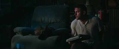 [TV playing indistinctly] - Dog