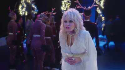 Uh, Woody Ms., Ms. Dolly.
Ms., Ms. Dolly Parton. - Dolly Parton's Mountain Magic Christmas