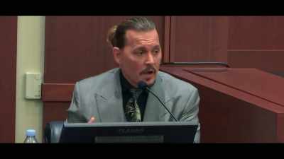 Um, he holds up this bottle, - Depp V Heard