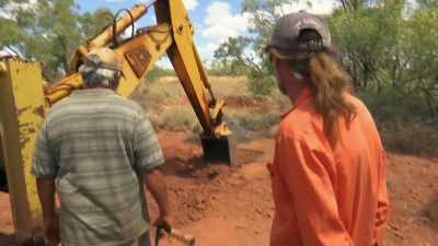Under the topsoil
is the cap rock. Hard as nails. - Outback Opal Hunters