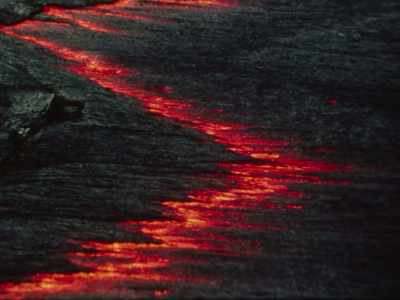 Unlike red volcanoes,
which form when plates pull apart, - Fire of Love
