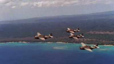 Unload another massive
barrage onto the island. - The Pacific War in Color