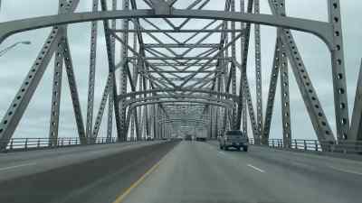 [upbeat acoustic guitar music] - American Highway