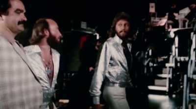 [upbeat disco music playing] - The Bee Gees: How Can You Mend a Broken Heart