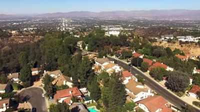 [upbeat music playing] - Buying Beverly Hills