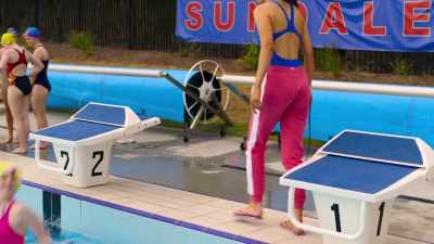 [upbeat pop music] - Swimming for Gold