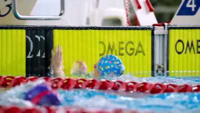 [uplifting music] - Swimming for Gold
