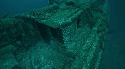 Wade: ON THE SHIP'S SIDE,
DIVERS DISCOVER A NAME, - Mysteries of the Deep