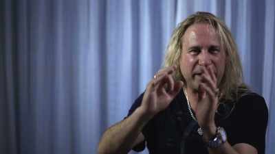 "Wait 'til you hear this."
He goes "It's huge." - Randy Rhoads: Reflections of a Guitar Icon