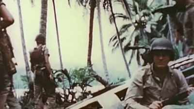 Warmed-over C-rations and
stale coffee passed for chow. - The Pacific War in Color