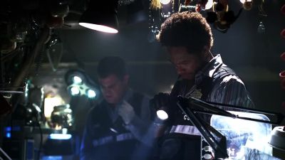 Warrick, take a look at this. - CSI: Crime Scene Investigation