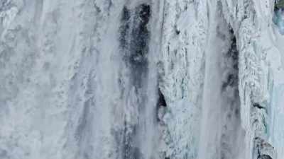 Water crashing from the
falls churns the pool below, - Yellowstone: One-Fifty