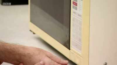 We close the door, we press time... MICROWAVE BEEPS - Back in Time for Dinner