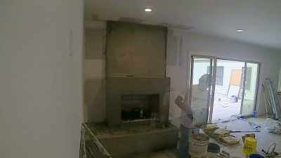 We decided to plaster
their new fireplace,
which I love. - Why the Heck Did I Buy This House?