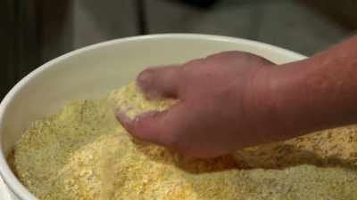 We ground it up into
just about cornmeal,
it's pretty fine. - Moonshiners: Master Distiller