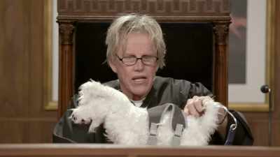 We have a wire going
through the coat
and coming out here. - Gary Busey: Pet Judge