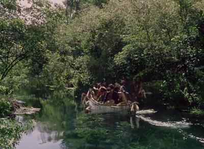 We move slowly down 
a strange and wonderful stream, - Distant Drums