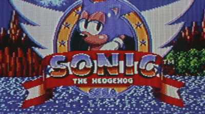 We walk over to a screen,
and here's this guy Sonic. - Console Wars