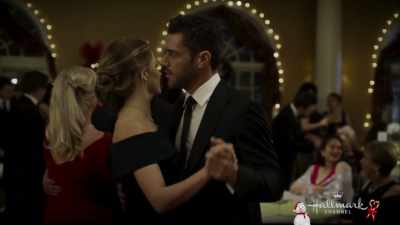 Well... don't look,
but he's watching. - Christmas Wishes & Mistletoe Kisses