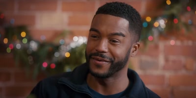- Well, maybe I'll just have
to do something about that. - Christmas with a Kiss