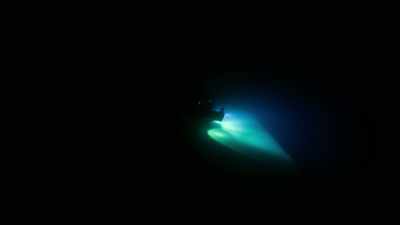 We're here,
a kilometer below the ocean surface. - Welcome to Earth