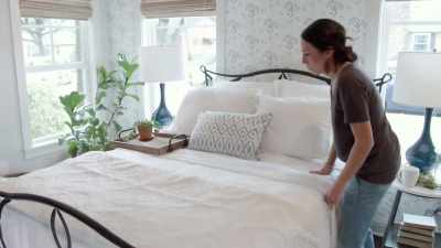 We've got floral wallpaper,
beautiful white bedding, - Fixer Upper: Behind the Design