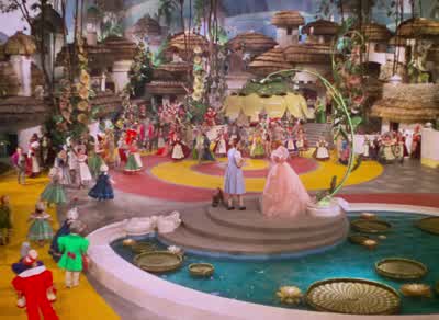 It really was no miracle What happened was just thisThe wind began to switch The house to pitchAnd suddenly the hinges Started to unhitchJust then the Witch To satisfy an itchWent flying on her broomstick Thumbing for a hitchAnd oh what happened then was - The Wizard of Oz