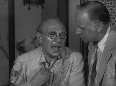 What's that hanging
from his belt in back? - Alfred Hitchcock Presents