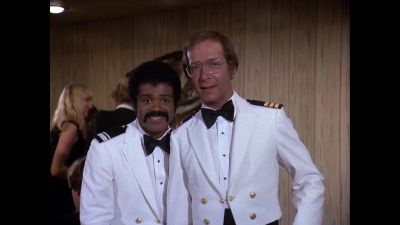 What's this?
A waiter kissing a passenger? - The Love Boat